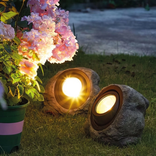 Solar LED garden light in the shape of a stone