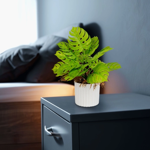 Decorative artificial monstera in a flowerpot