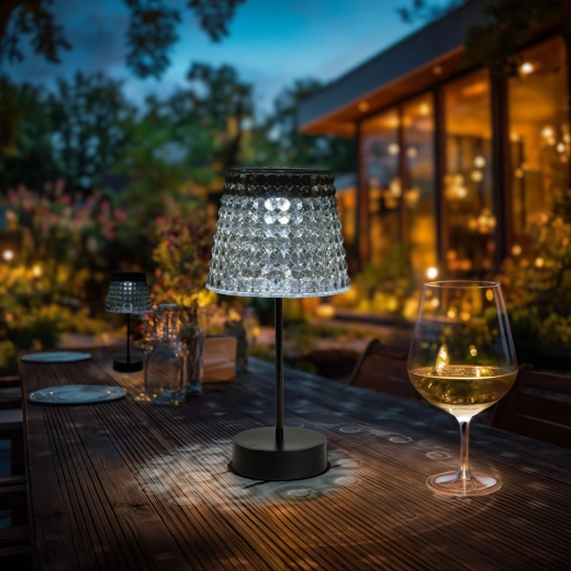 Damaged solar table lamp with smoke-colored shade and cool white LED