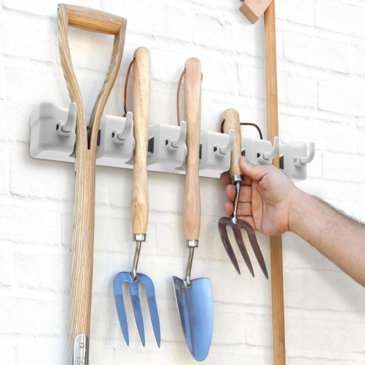 Universal Wall-Mounted Holder for Tools and Cleaning Supplies
