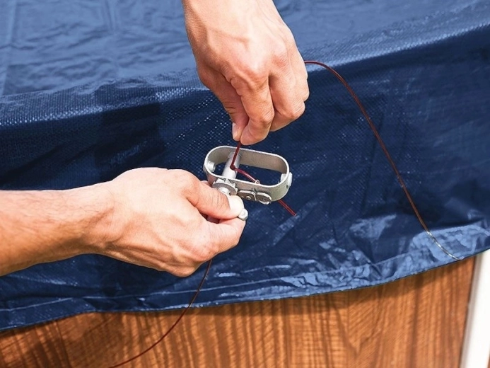 Secure fastening with cable and ratchet