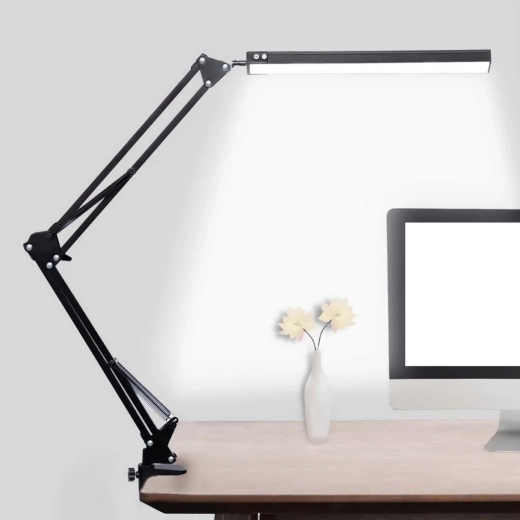 Sturdy metal clamp saves desk space