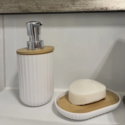 Elegant and functional dispenser with soap dish